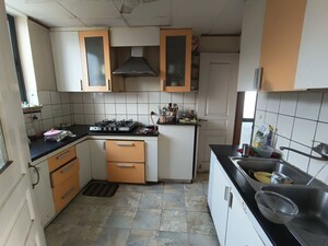 Kitchen in 1 RK Apartment at Unitech Uniworld Gardens, Sector 47 – for Rent