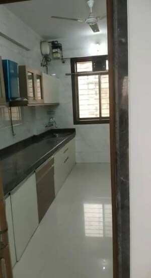 Kitchen in 4 BHK Apartment at Safal Nav Parmanu CHS, Chembur – for Rent