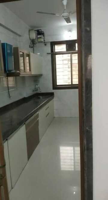Kitchen in 4 BHK Apartment at Safal Nav Parmanu CHS, Chembur – for Rent