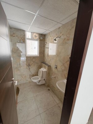 Bathroom in 3 BHK Apartment at Vardhman Empire Estate, Mahapura – for Rent