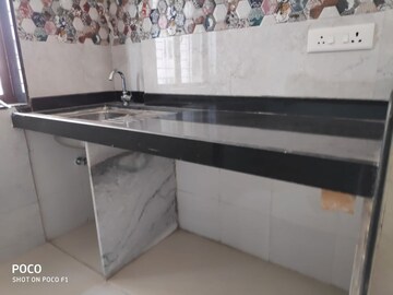 Kitchen in 2 BHK Apartment at Ani Anu Sri Balaji Enclave, Malad West – for Sale