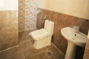 Bathroom in 3 BHK Apartment at Presithum, Sector 25 Yamuna Expressway – for Rent