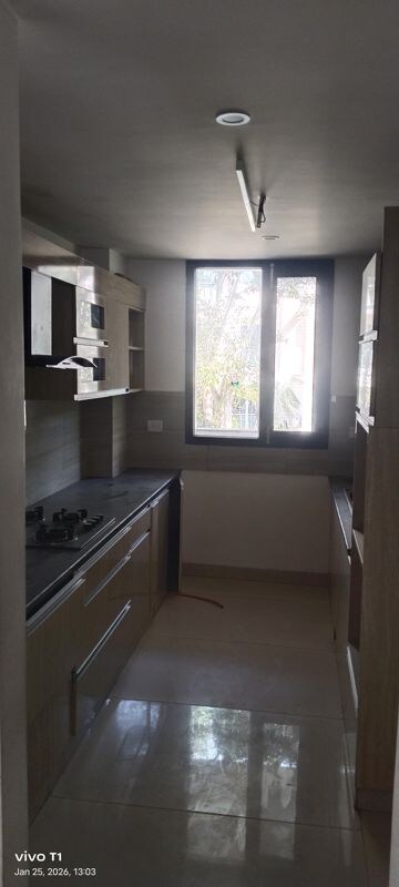 Kitchen in 3.5 BHK Builder Floor at Ansal API Esencia, Sector 67 – for Rent