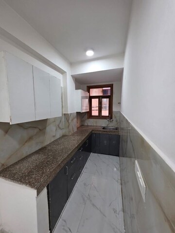 Kitchen in 2 BHK Builder Floor at Khirki Extension – for Sale