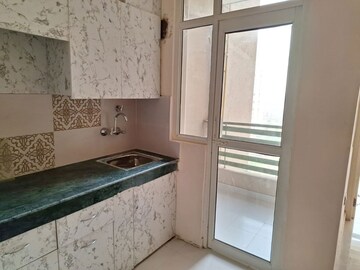 Kitchen in 2 BHK Apartment at Nilaya Greens, Raj Nagar Extension – for Rent