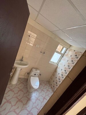 Bathroom in 2 BHK Apartment at Nilaya Greens, Raj Nagar Extension – for Rent