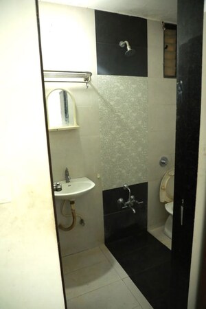 Bathroom in 2 BHK Apartment at Chanakyapuri – for Rent