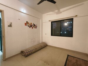 Living Room in 2 BHK Apartment at Patil Raghukul Nagari CHS, Bopodi – for Rent