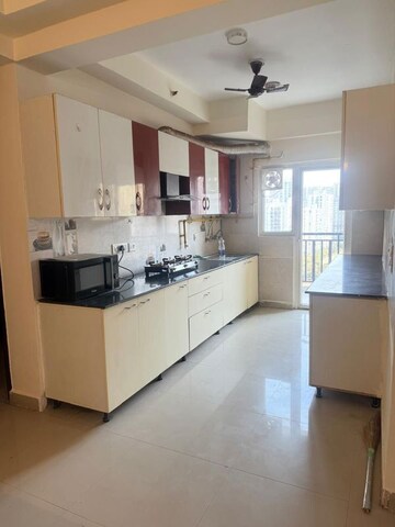 Kitchen in 3 BHK Apartment at Gaur Sportswood, Sector 79 – for Rent
