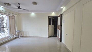 Living Room in 1 BHK Apartment at Agarwal Trinity Towers, Malad West – for Rent