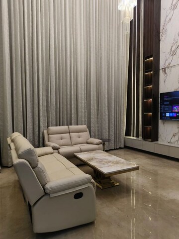 Living Room in 4 BHK Apartment at Apex The Rio, Ahinsa Khand 2 – for Rent