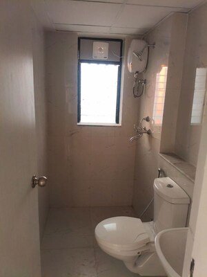 Bathroom in 1 BHK Apartment at Runwal Gardens, Dombivli East – for Rent