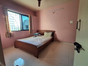 Bedroom in 2 BHK Apartment at Sai Puram Building, Dhayari – for Rent