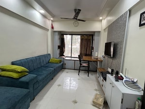 Living Room in 1 BHK Apartment at Kopar Khairane – for Sale