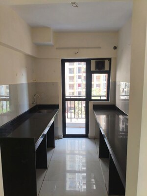 Kitchen in 2 BHK Apartment at Runwal Gardens Phase I, Dombivli East – for Rent
