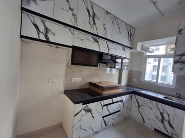 Kitchen in 2.5 BHK Apartment at Smart World Gems, Sector 89 – for Rent