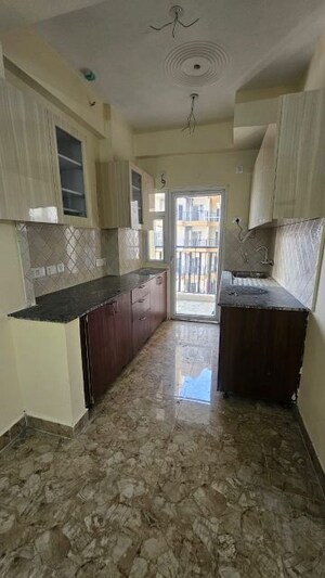 Kitchen in 3 BHK Apartment at Amrapali Enchante, Tech Zone 4 Greater Noida – for Sale