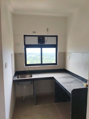Kitchen in 2 BHK Apartment at Runwal Gardens, Dombivli East – for Rent