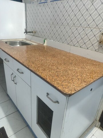 Kitchen in 1 RK Villa at RWA Apartments Sector 30, Sector 30 – for Rent