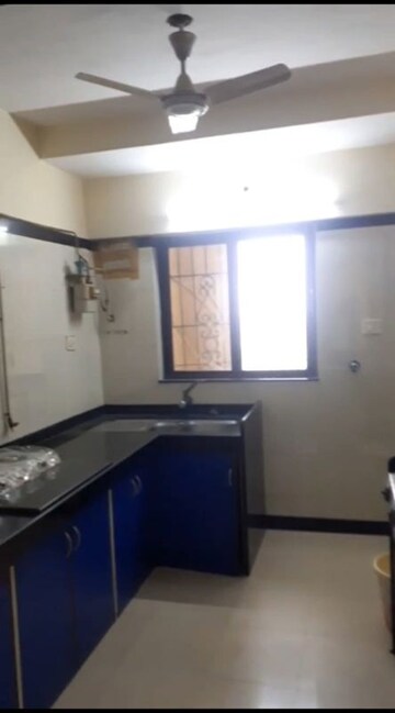 Kitchen in 2 BHK Apartment at Serenity Heights, Malad West – for Rent