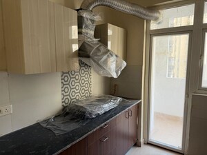 Kitchen in 3 BHK Apartment at Amrapali Heartbeat City, Sector 107 – for Rent