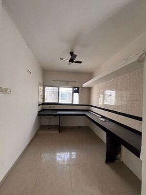 Kitchen in 2 BHK Apartment at G K Daffodils Housing Society, Pimple Saudagar – for Rent