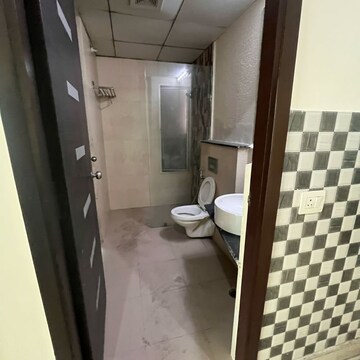 Bathroom in 3 BHK Apartment at Gaur Saundaryam, Haibatpur – for Rent