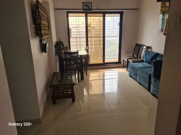Living Room in 2 BHK Apartment at Swaraj Bella Vista, Ghansoli – for Rent