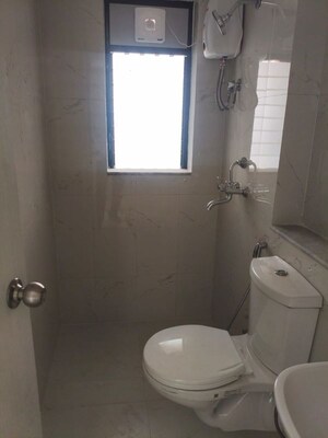 Bathroom in 1 BHK Apartment at Runwal Gardens, Dombivli East – for Rent