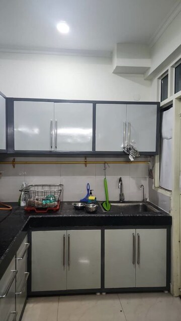 Kitchen in 2 BHK Apartment at JKG Palm Court, Sector 16c Greater Noida – for Rent