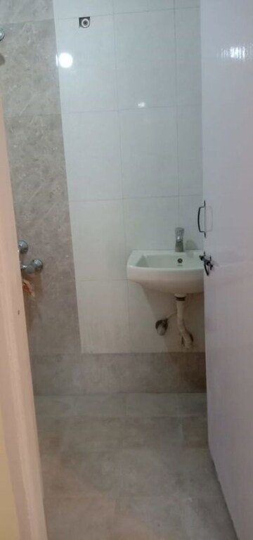 Bathroom in 1 RK Apartment at Orchid Complex Gundecha, Kandivali East – for Rent