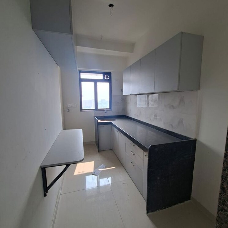 Kitchen, lotus-unity 2 Bedroom 724 Sq.Ft. Apartment In Yari Road Mumbai 9904251