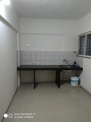 Kitchen in 2 BHK Apartment at Jalan Aura County Pune, Wagholi – for Rent