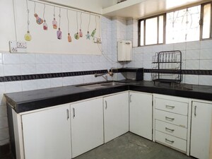 Kitchen in 2 BHK Apartment at Samruddhi Apartments, Camp – for Rent