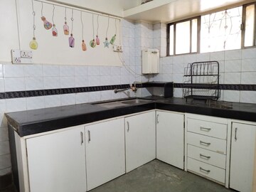 Kitchen in 2 BHK Apartment at Samruddhi Apartments, Camp – for Rent