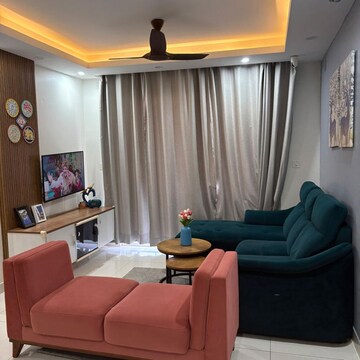 Living Room in 2 BHK Apartment at Puravankara Palm Beach, Essel Gardens – for Rent