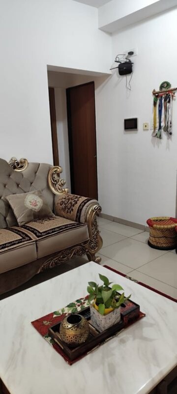 Living Room in 2 BHK Apartment at The Chatterjee The Crown Greens, Hinjewadi – for Rent