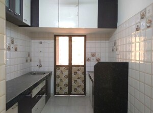Kitchen in 1 BHK Apartment at Realtech Heights, Golani Naka – for Rent