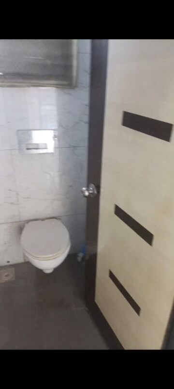 Bathroom in 1 BHK Apartment at RNA NG Canary, Mira Road – for Rent