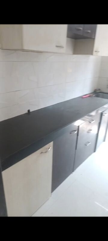 Kitchen in 1 BHK Apartment at RNA NG Canary, Mira Road – for Rent