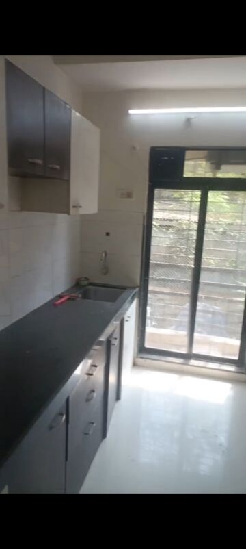 Kitchen in 1 BHK Apartment at RNA NG Canary, Mira Road – for Rent