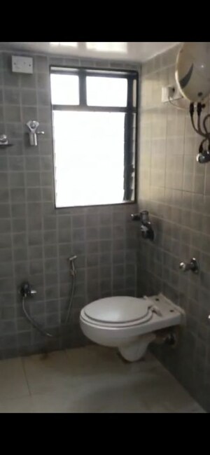 Bathroom in 3 BHK Apartment at Atul Blue Orbit, Malad West – for Rent