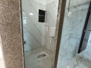 Bathroom in 1 BHK Apartment at Shellproof Gladiolus Tower, Vasai East – for Rent