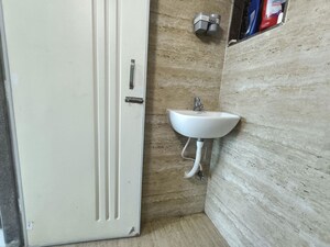 Bathroom in 1 BHK Apartment at Shellproof Gladiolus Tower, Vasai East – for Rent