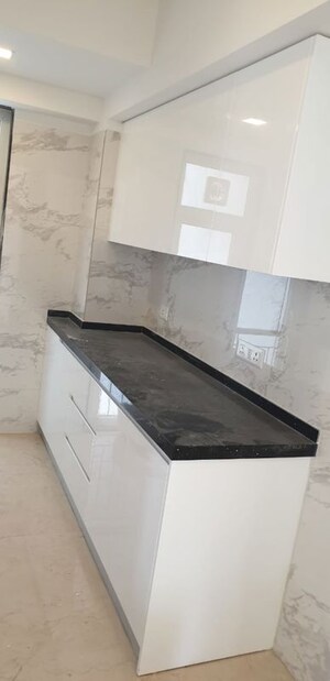 Kitchen in 3 BHK Apartment at Ruparel Ariana, Parel – for Sale