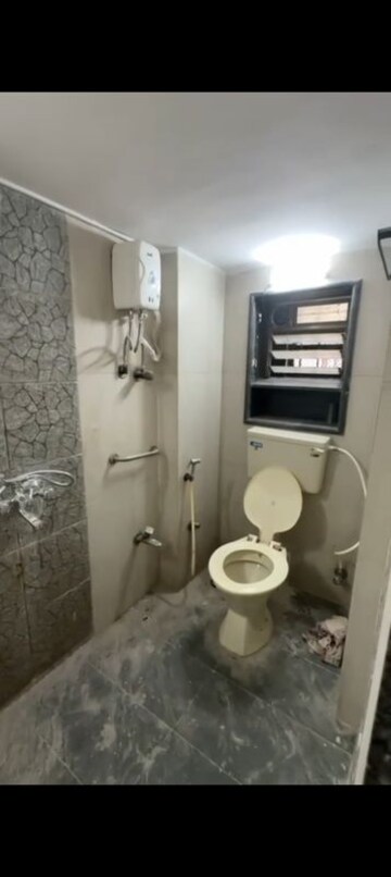 Bathroom in 2 BHK Apartment at Ahimsa Niketan CHS, Malad West – for Rent