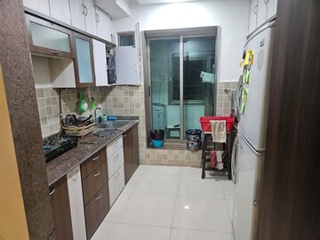 Kitchen in 3 BHK Apartment at T Bhimjyani Neelkanth Woods, Manpada – for Rent