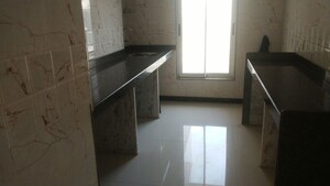 Kitchen in 2 BHK Apartment at Ani Anu Sri Balaji Enclave, Malad West – for Sale