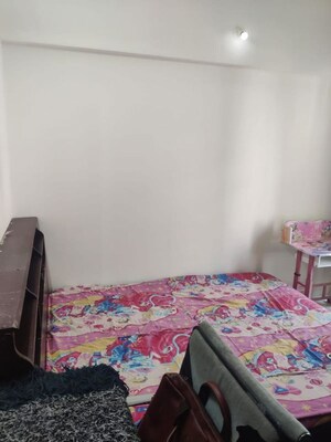 Bedroom in 2 BHK Apartment at Karan Ceto, Wadgaon Sheri – for Rent