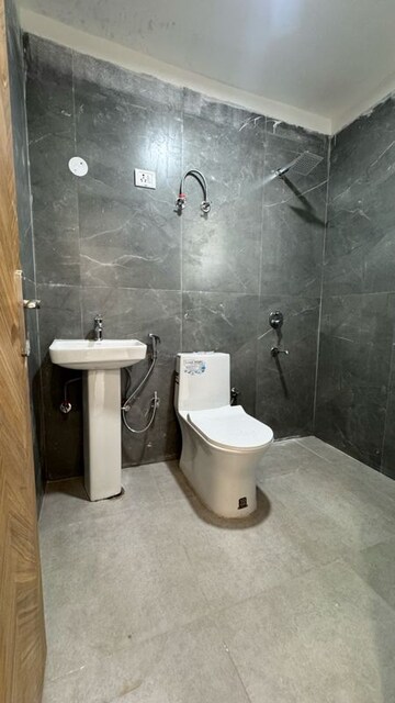 Bathroom in 1 BHK Apartment at Palm Residency Chhatarpur, Rajpur Khurd Extension – for Rent